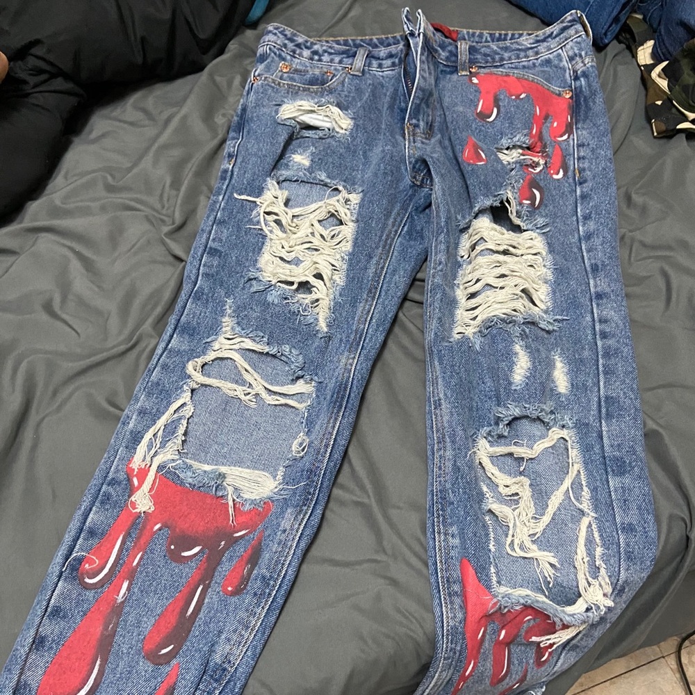 Distressed drip jeans